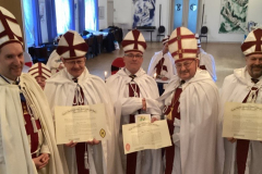 Certificates presented by the District Superintendent (John McKinnon) watched by the High Priest (left), Andreas Riehl.